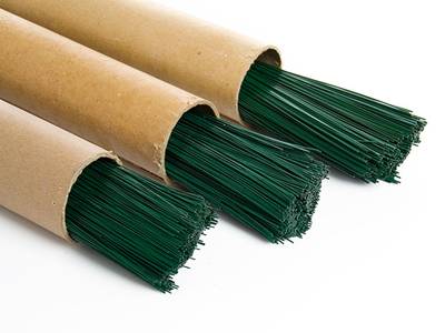 Three bundles of green PVC coated straight cut wire.