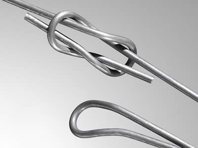 One single metal bending tie and a whole quick link bale tie.