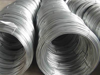 Many rolls of galvanized high steel wire placed in a warehouse.