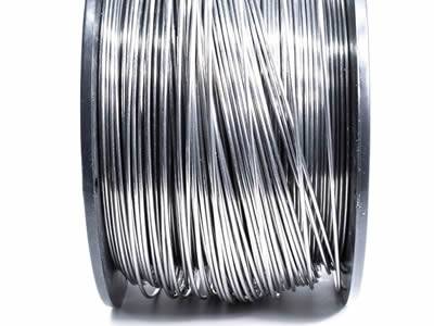 One vertical spool of hot-dipped galvanized zinc wire.