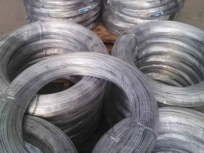 Many coils of zinc wire packaged with plastic films.