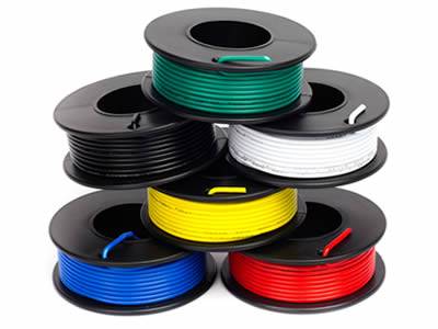 Six rolls of stacked spool wire layer by layer with different coating colors.