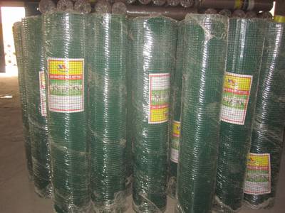 Welded wire meshes are packed in plastic films in a warehouse.