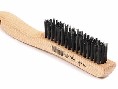 Carbon steel welding wire with wooden handle to form a brush.